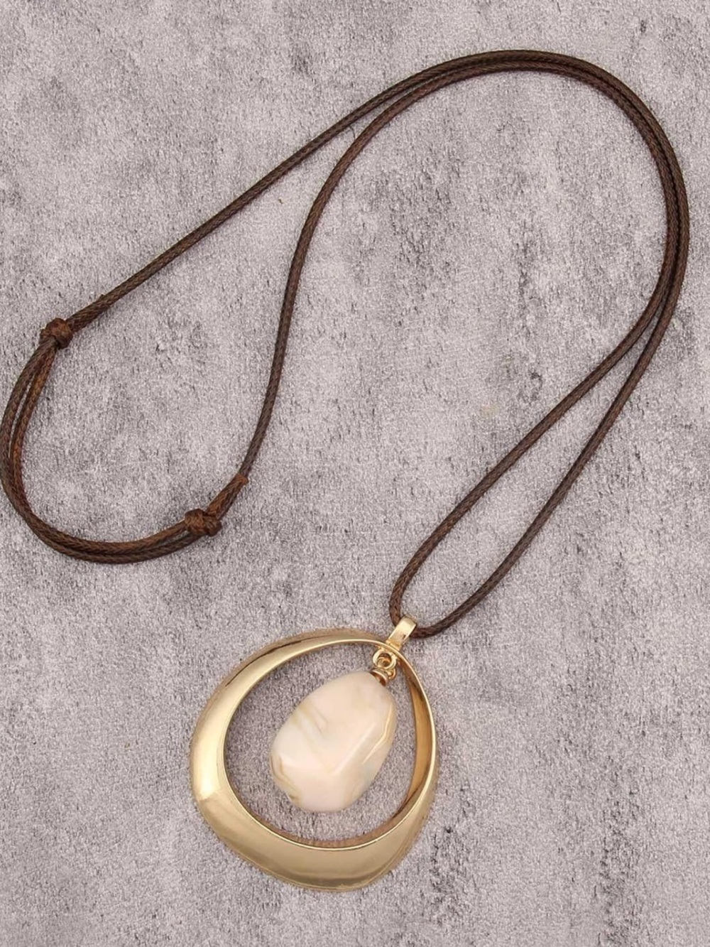 Anthropologie Gold Color Crescent Pendant with Cream Stone on Brown Cord